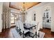 Formal dining room with hardwood floors, a chandelier, and seating for eight people at 9099 E Harvard Ave, Denver, CO 80231