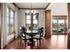 Dining Room with hardwood floors and windows overlooking the large yard at 9099 E Harvard Ave, Denver, CO 80231
