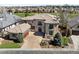 Stunning two-story home with a tile roof, well-manicured landscaping, and an attached two-car garage at 9099 E Harvard Ave, Denver, CO 80231