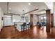 Gourmet kitchen features a center island with bar seating, stainless steel appliances, and views to the backyard at 9099 E Harvard Ave, Denver, CO 80231