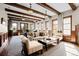 Cozy Living Room with wooden beams, great views, comfortable furnishings and home office at 9099 E Harvard Ave, Denver, CO 80231