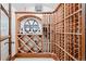 Custom wine cellar featuring a wooden wine rack and custom signage at 9099 E Harvard Ave, Denver, CO 80231