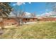 Spacious backyard with a well-maintained lawn, ideal for recreation and outdoor activities at 6614 Everett St, Arvada, CO 80004