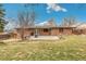 Expansive backyard featuring a concrete patio, perfect for outdoor entertaining and relaxation at 6614 Everett St, Arvada, CO 80004