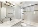 Bathroom features a white vanity, updated fixtures, and subway tile in the shower at 6614 Everett St, Arvada, CO 80004