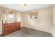 Bedroom featuring neutral walls, carpet, and a window with a view outside at 6614 Everett St, Arvada, CO 80004