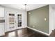 Cozy dining area with modern lighting and backyard access at 6614 Everett St, Arvada, CO 80004