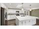 Updated kitchen with quartz counters, stainless steel appliances, and ample storage at 6614 Everett St, Arvada, CO 80004