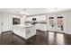 Modern kitchen with stainless steel appliances and white cabinets at 6614 Everett St, Arvada, CO 80004