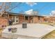 Concrete patio with convenient access to the house and space for outdoor dining and leisure at 6614 Everett St, Arvada, CO 80004