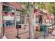 Festive storefronts adorned with American flags, flowers and outdoor benches at 6614 Everett St, Arvada, CO 80004