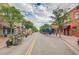 Lively street scene with shops and outdoor seating under a cloudy sky at 6614 Everett St, Arvada, CO 80004