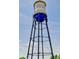 High-angle view of a tall water tower, featuring a blue sphere and a steel lattice structure at 6614 Everett St, Arvada, CO 80004
