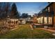 Serene backyard featuring a gazebo, deck, and lush green lawn, perfect for outdoor relaxation at 3015 Lowell Blvd, Denver, CO 80211