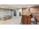 Basement features a bar with exposed brick, unique flooring, and custom wooden features at 3015 Lowell Blvd, Denver, CO 80211