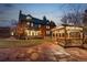 Home exterior featuring a well-maintained lawn, patio, and wooden gazebo at 3015 Lowell Blvd, Denver, CO 80211
