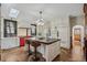 Gourmet kitchen with a large center island, a red oven and herringbone floors at 3015 Lowell Blvd, Denver, CO 80211