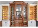 Vintage wood china cabinet with glass doors between custom white kitchen cabinets at 3015 Lowell Blvd, Denver, CO 80211