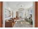 Bright living room with hardwood floors, a decorative chandelier, and views into other living spaces at 3015 Lowell Blvd, Denver, CO 80211