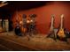 Stylish music room featuring a drum set and electric guitars at 3015 Lowell Blvd, Denver, CO 80211