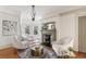 Inviting sitting room with fireplace, plush armchairs, and soaking tub by bay windows at 3015 Lowell Blvd, Denver, CO 80211