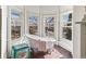 Clawfoot soaking tub surrounded by bright bay windows with views of the outdoors at 3015 Lowell Blvd, Denver, CO 80211