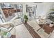 Bright sunroom with floor to ceiling windows, tile floor and views of backyard at 3015 Lowell Blvd, Denver, CO 80211