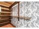Charming walk-in closet features a clothes bar, shelving, and deer-themed wallpaper at 3015 Lowell Blvd, Denver, CO 80211