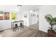 Bright dining area with modern table and chairs set, plus large windows at 1180 Newark St, Aurora, CO 80010