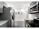 Contemporary kitchen featuring stainless steel appliances and sleek finishes at 1180 Newark St, Aurora, CO 80010