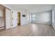 Large bedroom with neutral paint, vinyl flooring, and walk-in closet at 20521 E Bellewood Pl, Aurora, CO 80015