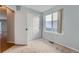Cozy bedroom with carpeted floors, a closet, and a window providing natural light at 20521 E Bellewood Pl, Aurora, CO 80015