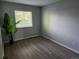 Cozy bedroom with laminate flooring, a neutral color scheme and ample natural light at 20521 E Bellewood Pl, Aurora, CO 80015