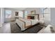 Staged bedroom with lots of natural light and comfortable seating at 20521 E Bellewood Pl, Aurora, CO 80015