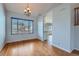 Bright dining room with hardwood floors and a large window providing ample natural light at 20521 E Bellewood Pl, Aurora, CO 80015