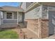 Charming home featuring a welcoming porch and a well-maintained lawn with brick accents at 20521 E Bellewood Pl, Aurora, CO 80015