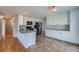 Well-appointed kitchen featuring granite countertops, tile flooring, and modern black appliances at 20521 E Bellewood Pl, Aurora, CO 80015