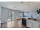 Modern kitchen with granite countertops, stainless steel appliances, tile floors and sliding doors to the yard at 20521 E Bellewood Pl, Aurora, CO 80015