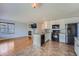 Open-concept kitchen and living area with a cozy fireplace, creating an inviting and spacious atmosphere at 20521 E Bellewood Pl, Aurora, CO 80015
