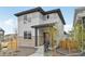 Beautiful two-story house with stone accents and a well-maintained lawn at 6225 N Nepal Ct, Aurora, CO 80019