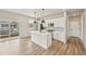 Kitchen features a center island, pendant lighting, and stainless steel appliances at 6225 N Nepal Ct, Aurora, CO 80019