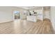 Living space showing modern kitchen with stainless appliances and direct access to outside space at 6225 N Nepal Ct, Aurora, CO 80019