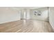 Open living space features natural light, light-colored walls, and light wood-look flooring throughout at 6225 N Nepal Ct, Aurora, CO 80019
