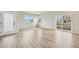 Spacious living room features wood floors, plenty of natural light, and access to the outside at 6225 N Nepal Ct, Aurora, CO 80019