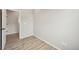 A well lit room with a doorway and wood flooring at 6225 N Nepal Ct, Aurora, CO 80019
