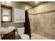 Basement bathroom with shower, toilet and small vanity at 7613 E 121St Dr, Thornton, CO 80602