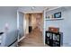 Bright hallway with wood floors and access to other rooms at 7613 E 121St Dr, Thornton, CO 80602