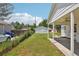 Backyard featuring a covered patio and lush green lawn with storage shed at 4465 S Bannock St, Englewood, CO 80110
