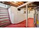 Unfinished basement with exposed ceilings and concrete walls, offering potential for customization at 4465 S Bannock St, Englewood, CO 80110