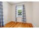 Bright bedroom with hardwood floors and a window overlooking the neighborhood at 4465 S Bannock St, Englewood, CO 80110
